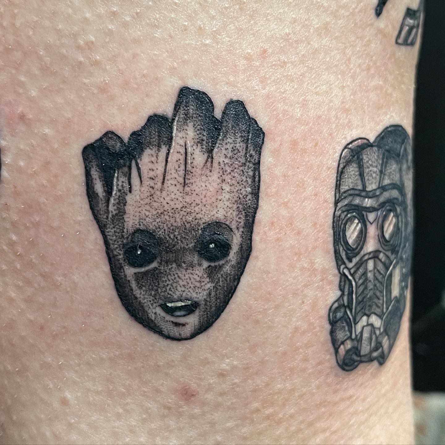 Groot and Rocket dotwork tattoo on the forearm by Zachary Kaufhold
