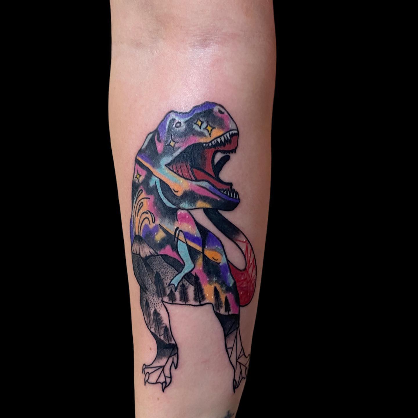 T-Rex geometric tattoo on the forearm by Zach Ashton