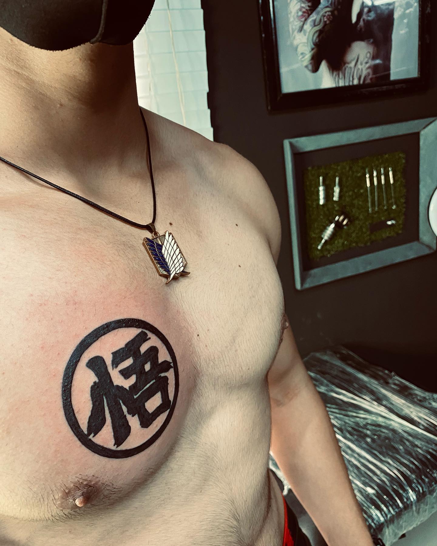 Kanji character black and grey tattoo on the chest by Luis Manuel Olivera, North Miami, Florida