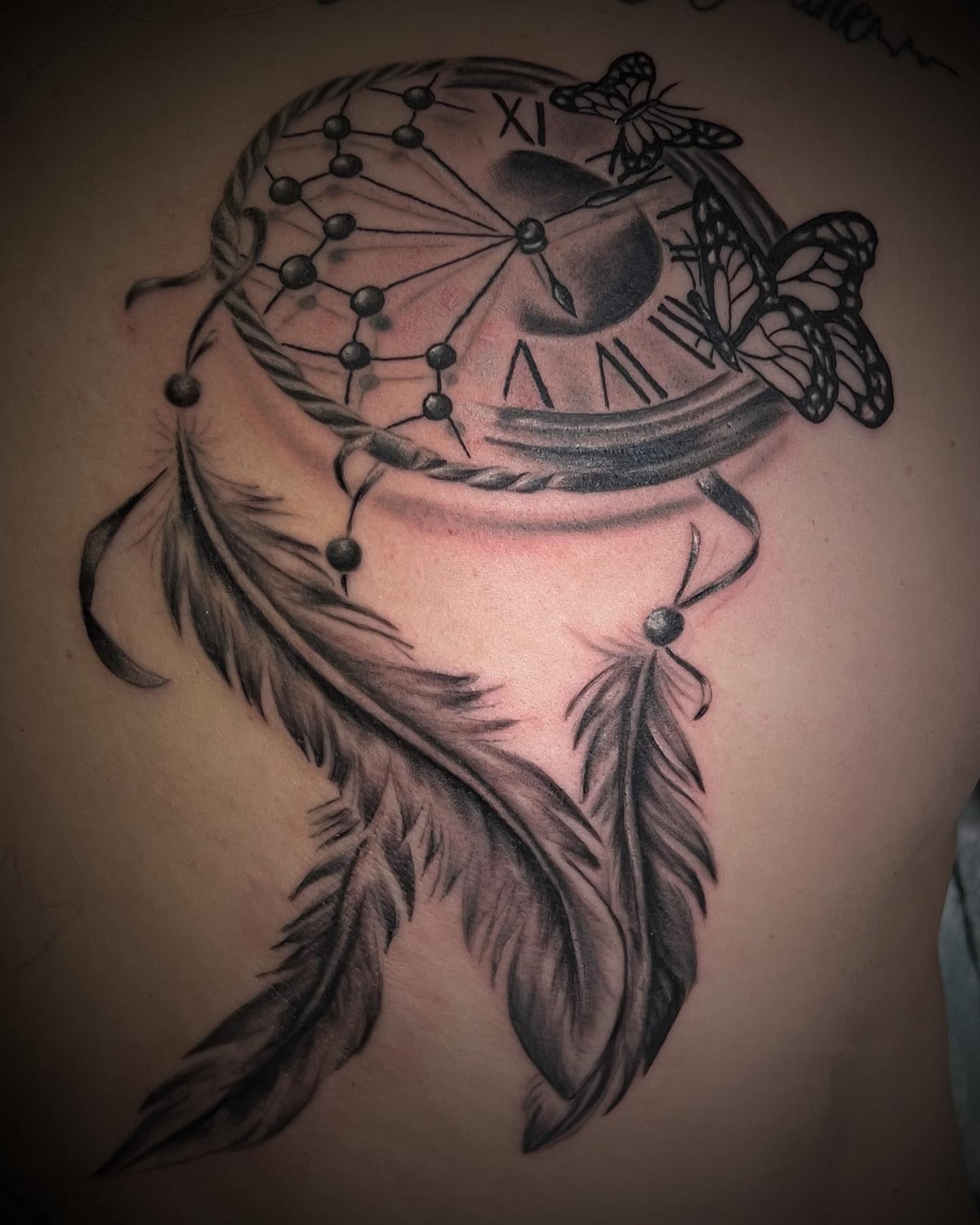 Dreamcatcher clock dotwork tattoo on the shoulder by Luis Cabrera, Cleveland, Ohio