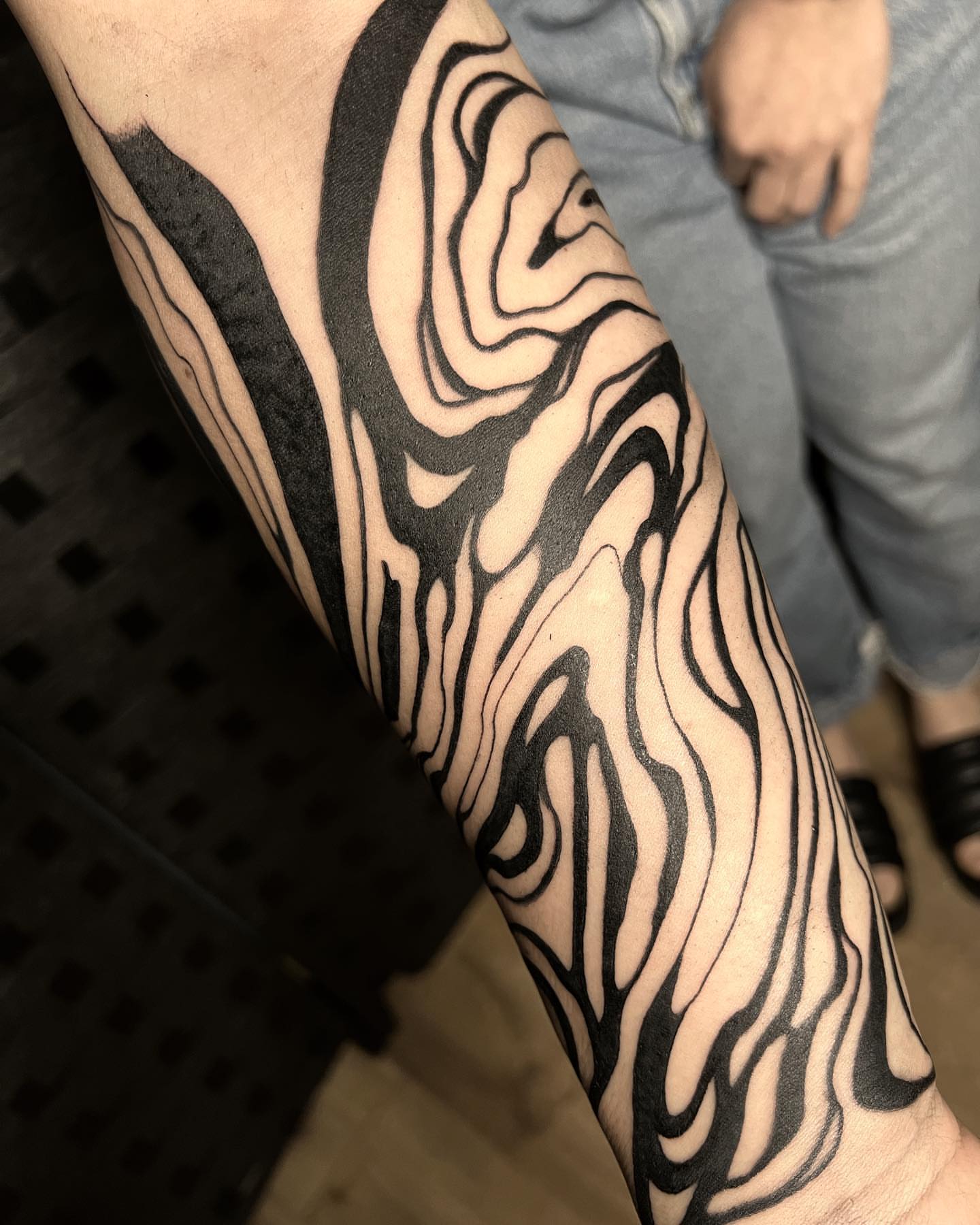 Abstract pattern black and grey tattoo on the forearm by Emily Jestine Francis