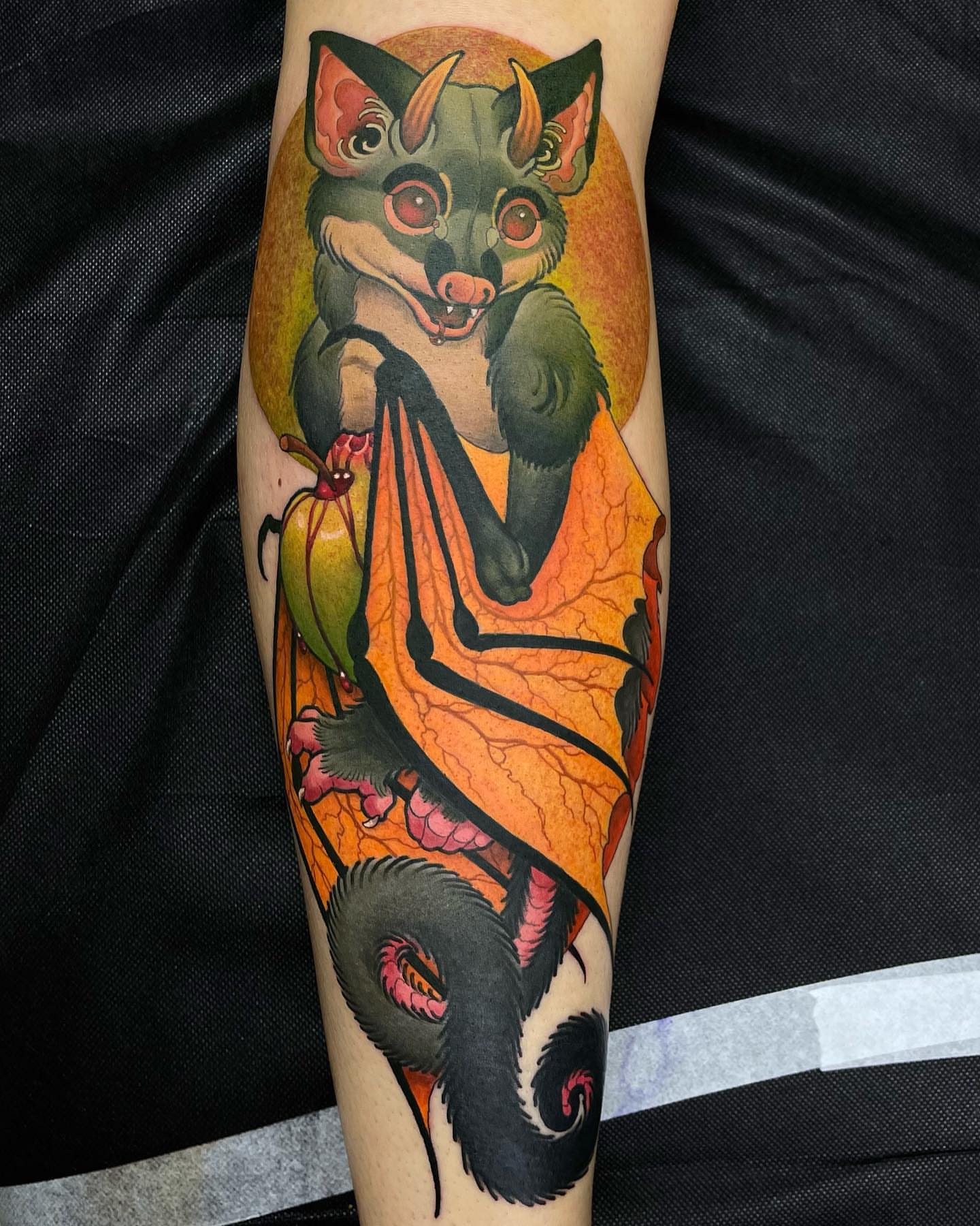 Possum and leaf American traditional tattoo on the forearm by Erin Chance