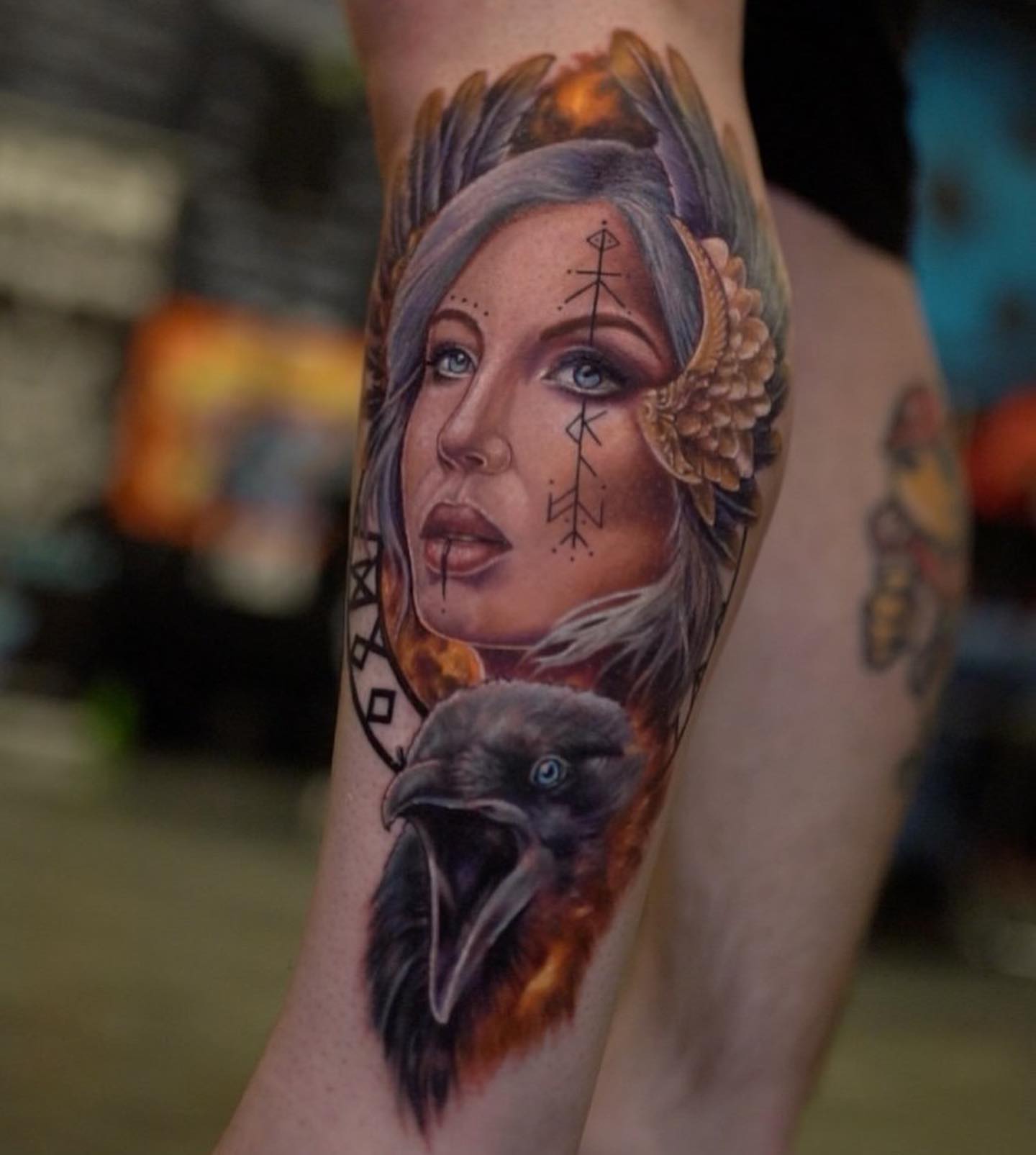 Woman with raven realism tattoo on the forearm by Amber Joy (AJ)