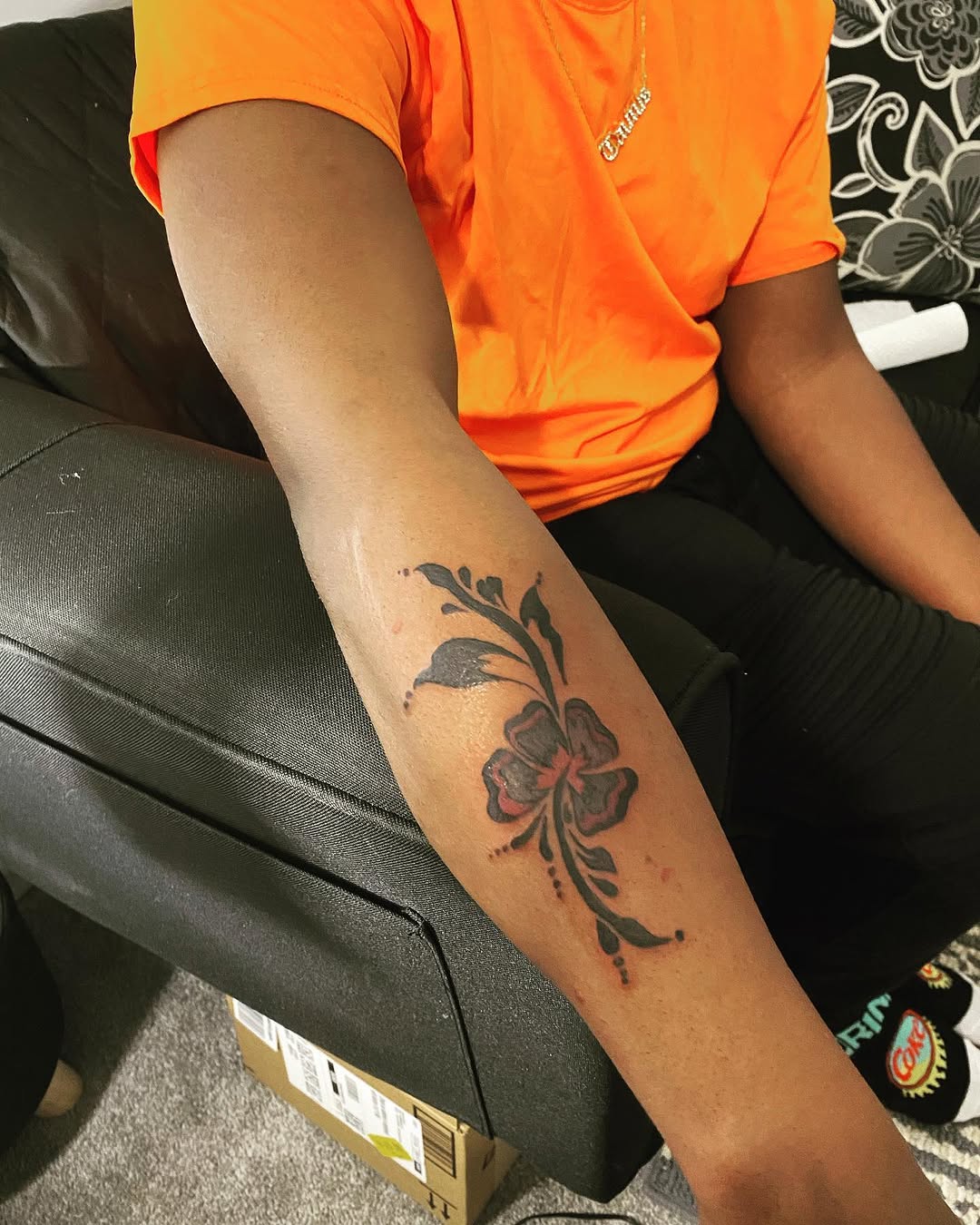 Flower with vine tattoo on the forearm by Danimals