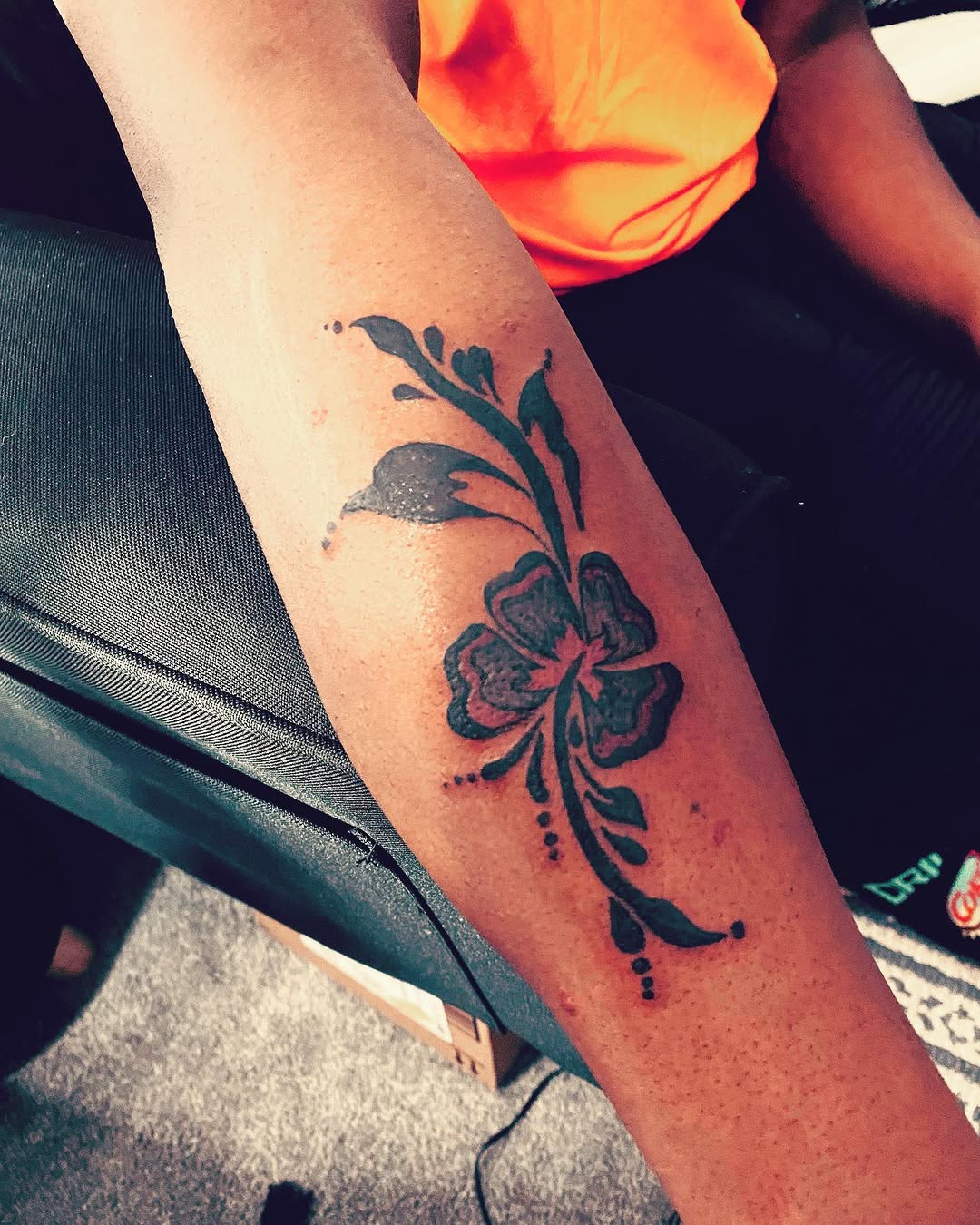 Hibiscus flower and vine tattoo on the forearm by Danimals