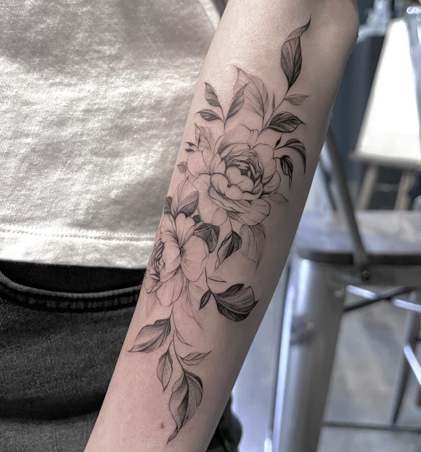 Floral bouquet black and grey tattoo on the forearm by G̵̨̗̗̈̅̓́͡ĕ̸̡̜̫̾̌̎̈͠ë̷̢̳̤̰̗͈̃͌͒̚͞