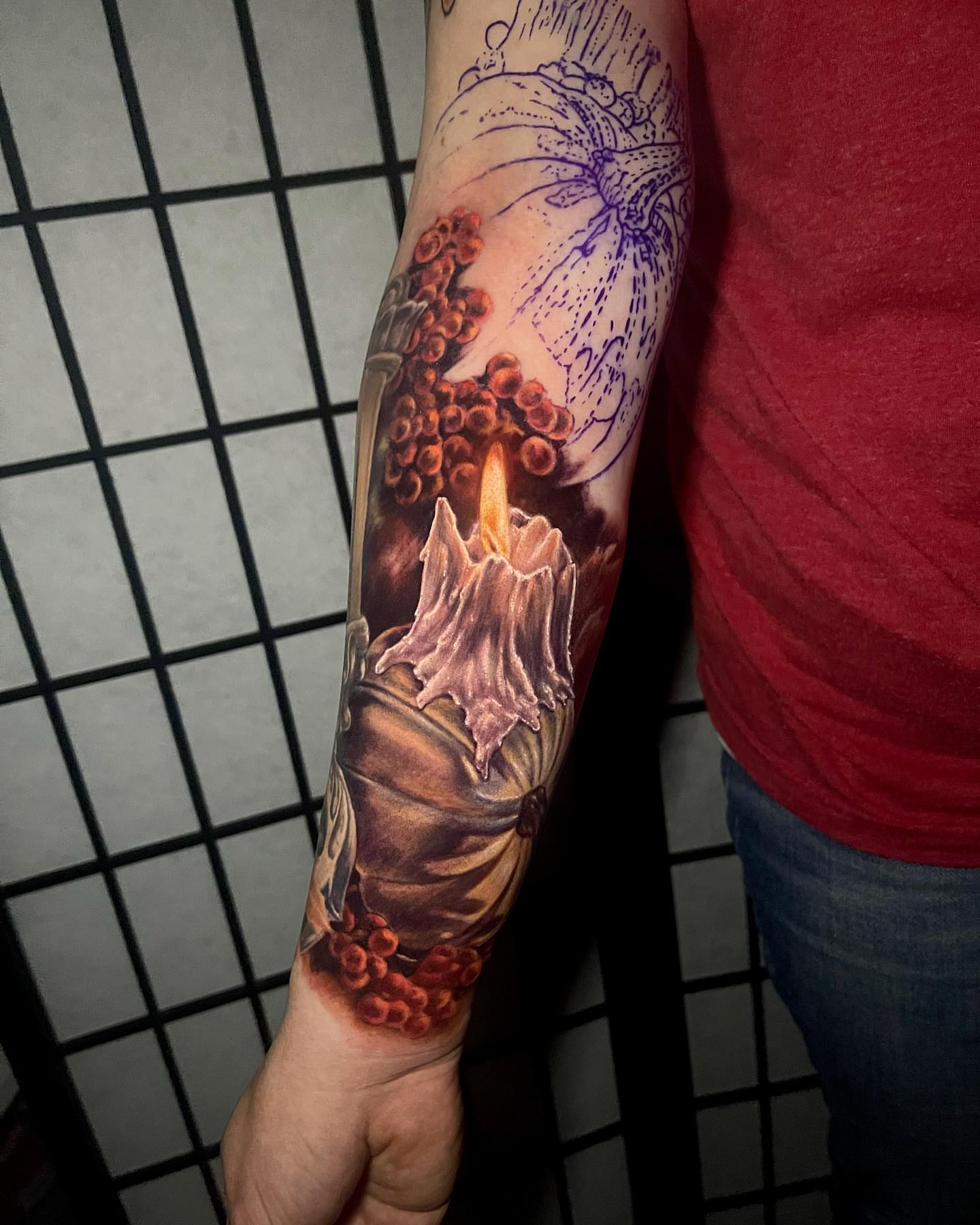 Candle and roses realism tattoo on the forearm by Amber Joy (AJ)
