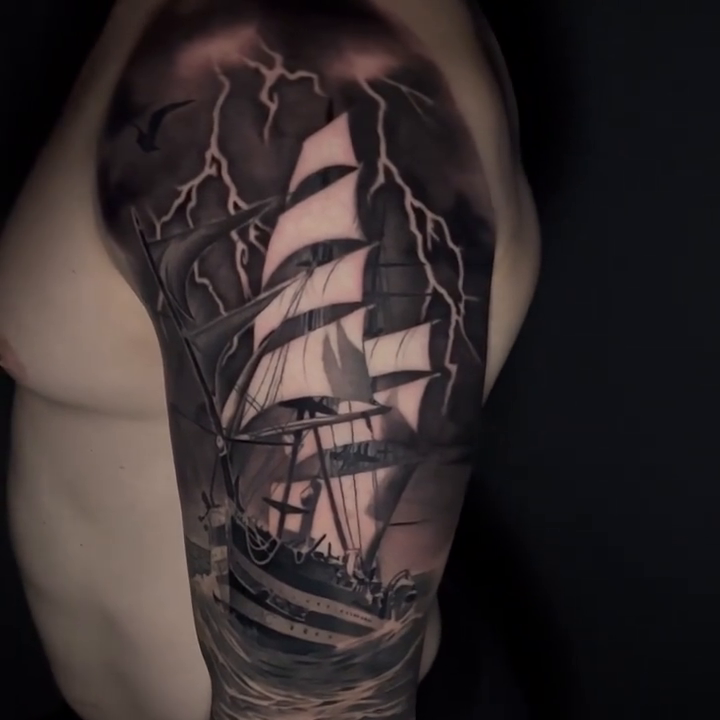 Sailing ship in a storm realism tattoo by Travis Chick
