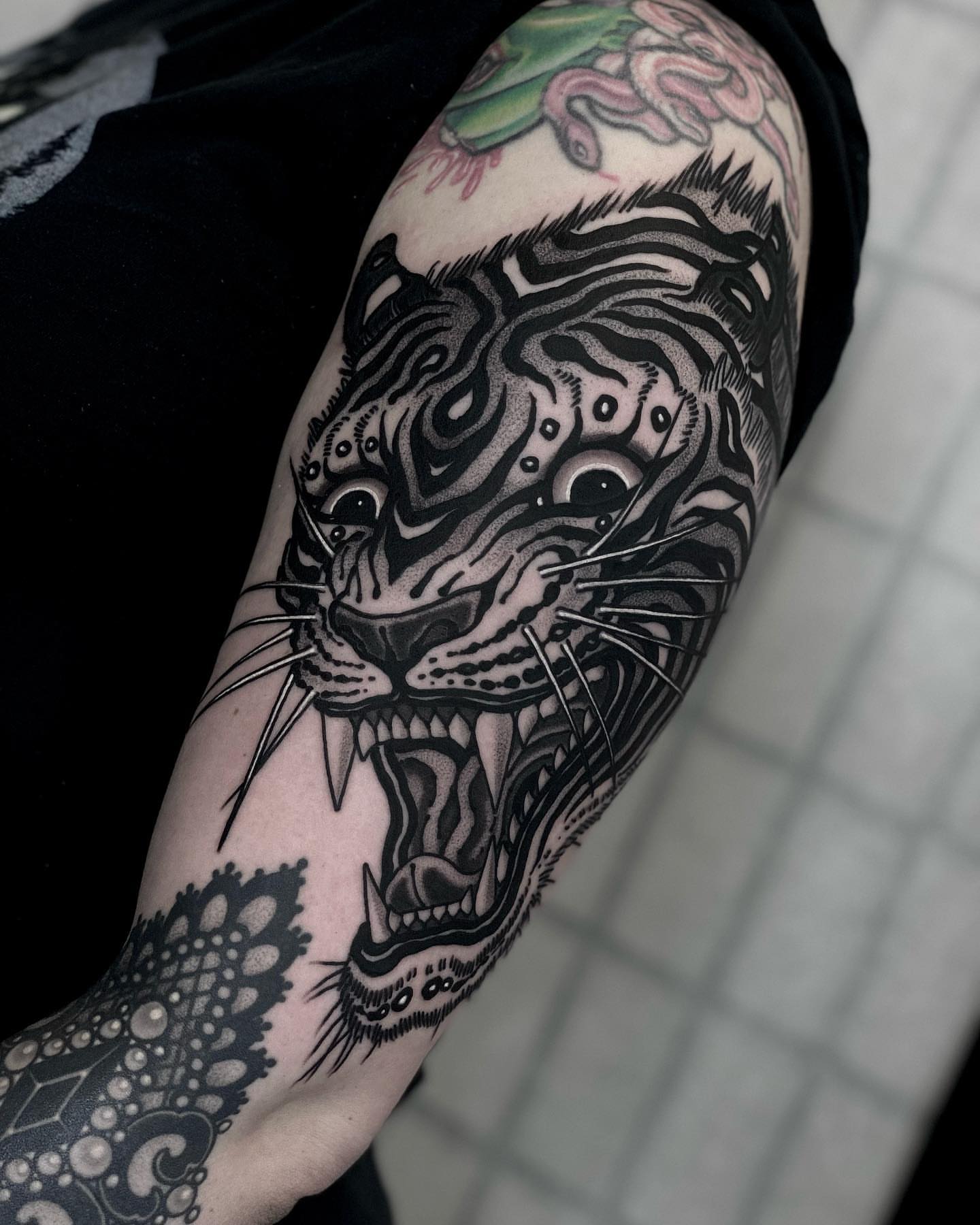 Roaring tiger realism tattoo on the forearm by Tyler Charles