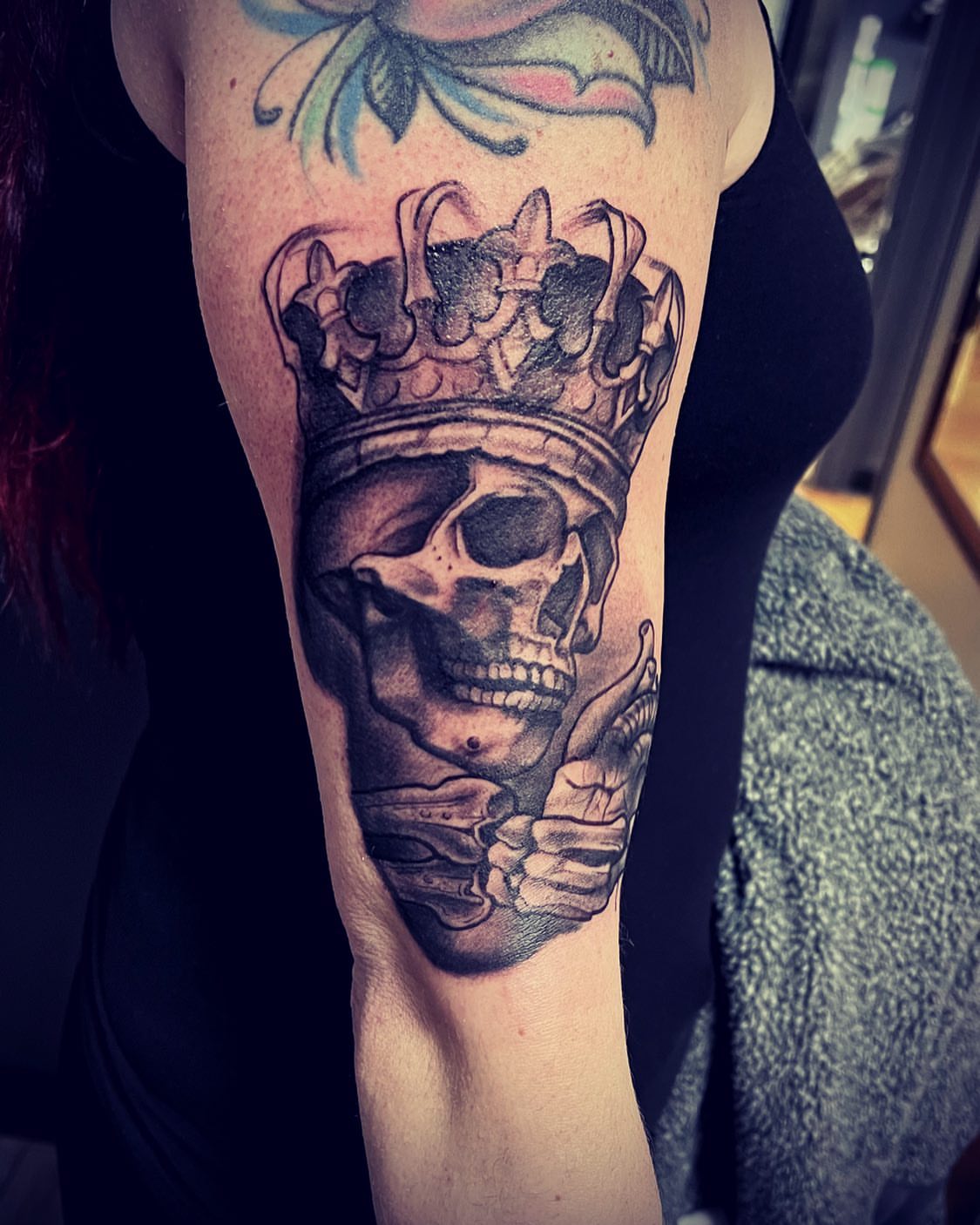 Skull wearing crown realism tattoo on the forearm by Tattoos by Dave