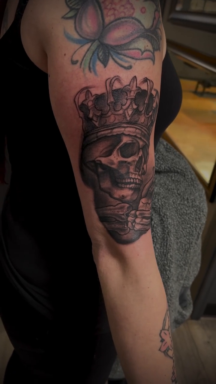 Skull with crown realism tattoo by Tattoos by Dave