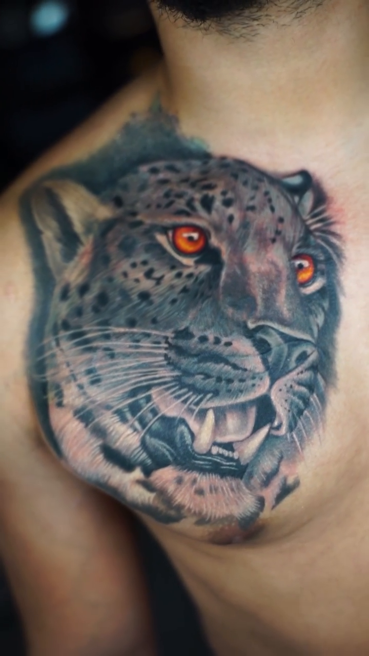 Leopard head realism tattoo by Amaury Ramirez