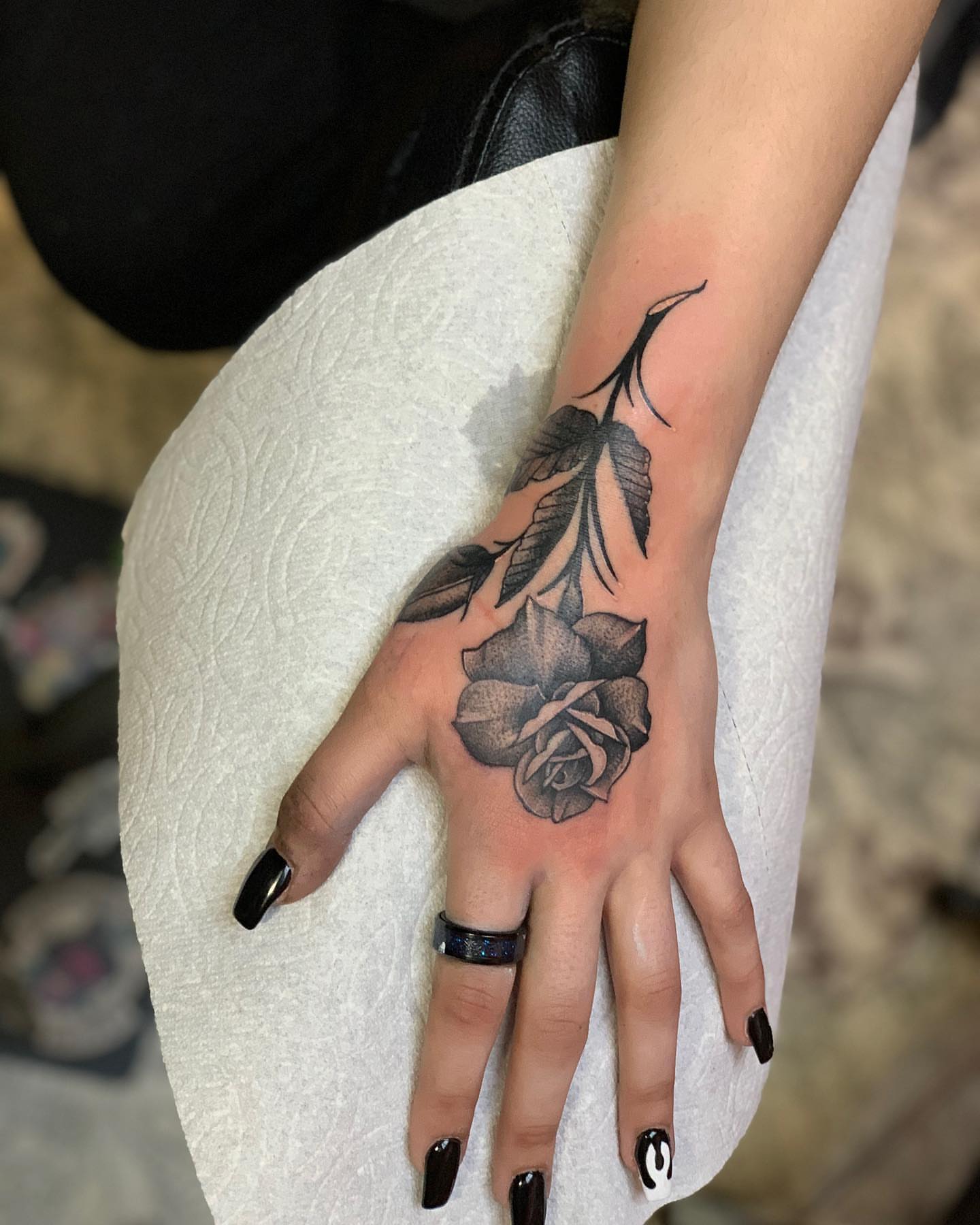 Rose black and grey tattoo on the hand by Don Robison