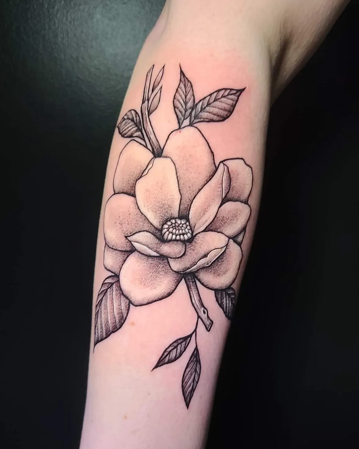 Magnolia flower black and grey tattoo on the forearm by Sydney Paige, Mentor, Ohio