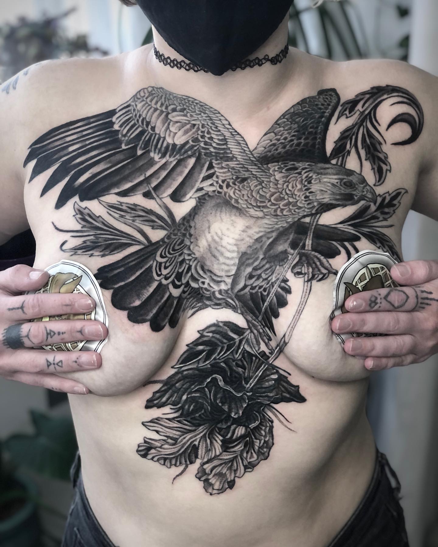 Hawk and foliage realism tattoo on the chest by Erick Mendivil