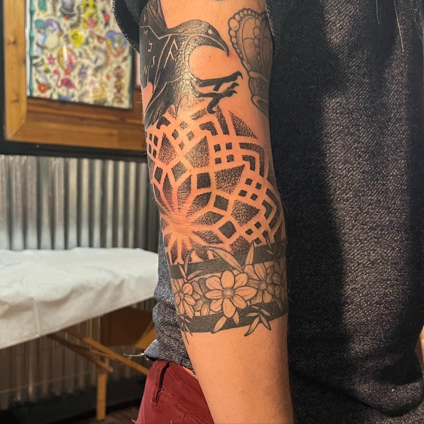 Geometric pattern with flowers dotwork tattoo on the forearm by Ałex, Portland, Oregon