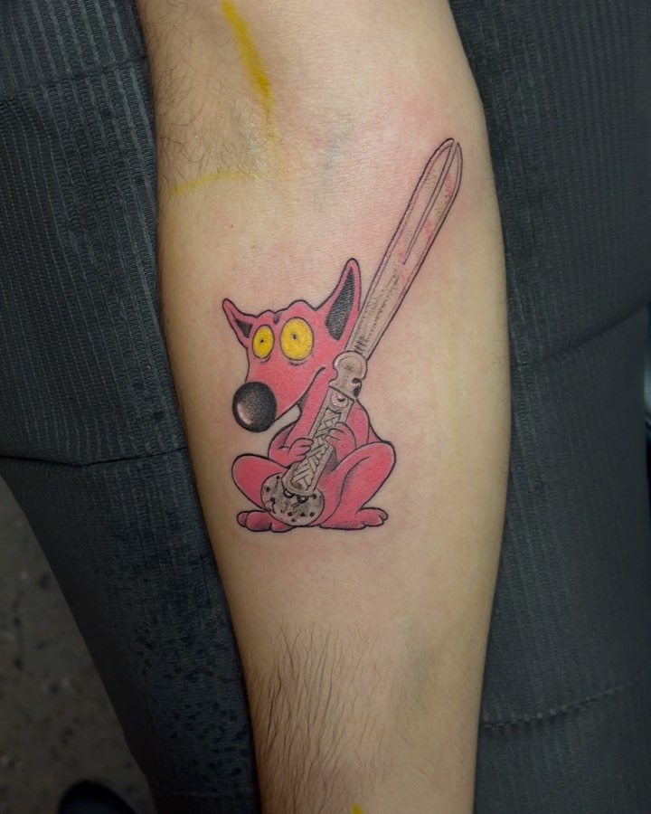 Pink rabbit playing guitar American traditional tattoo on the forearm by Bruno Guerrero
