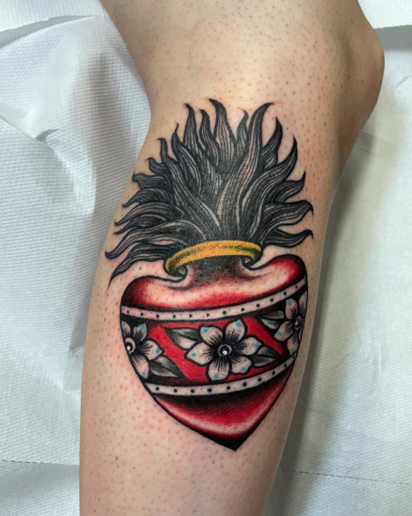 Heart with spiky hair American traditional tattoo on the forearm by Alessandro Pennella