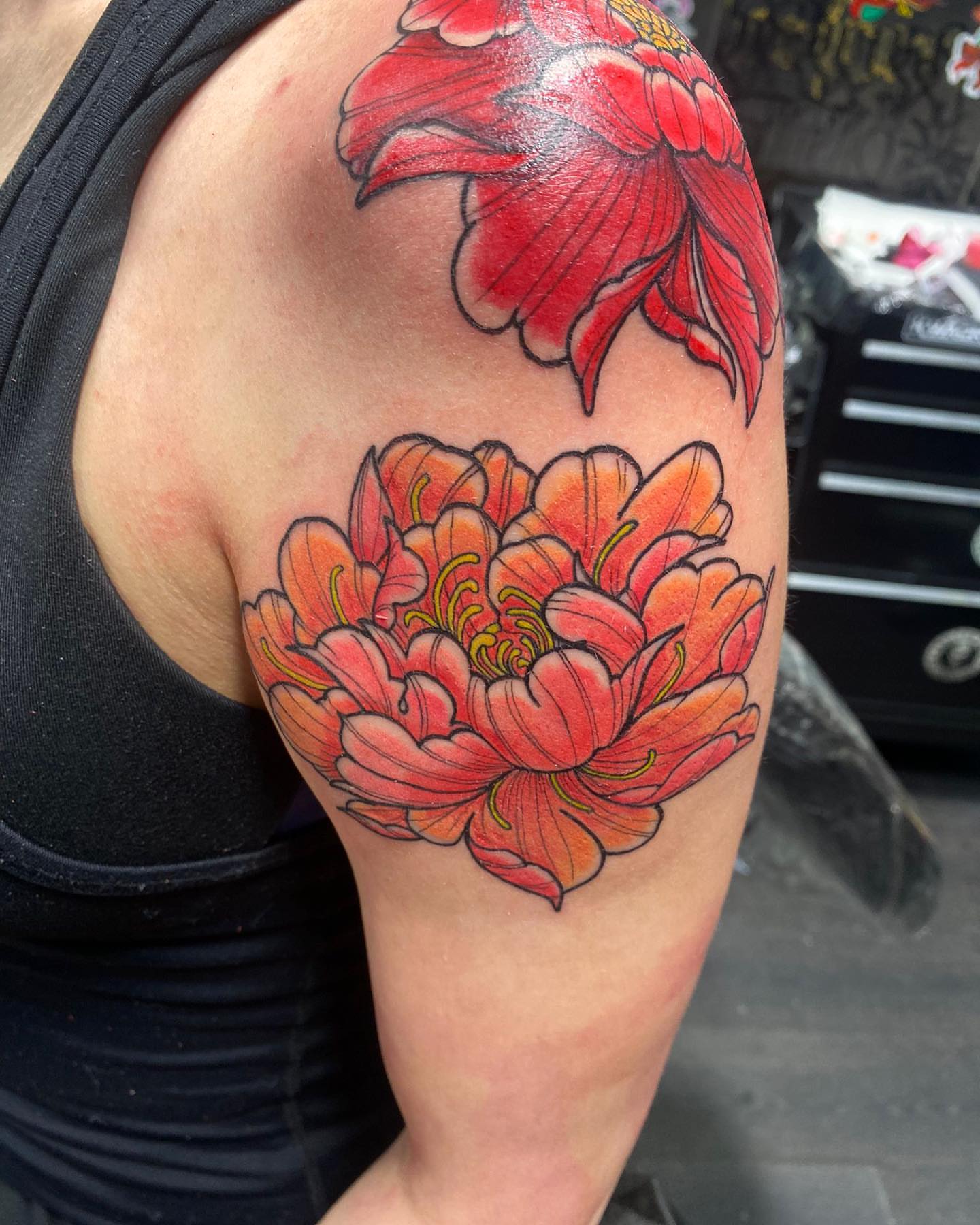 Chrysanthemum realism tattoo on the shoulder by Alberto Ramirez