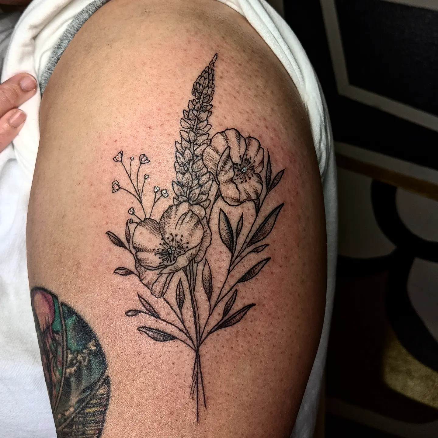 Floral bouquet black and grey tattoo on the shoulder by Aim 🤍