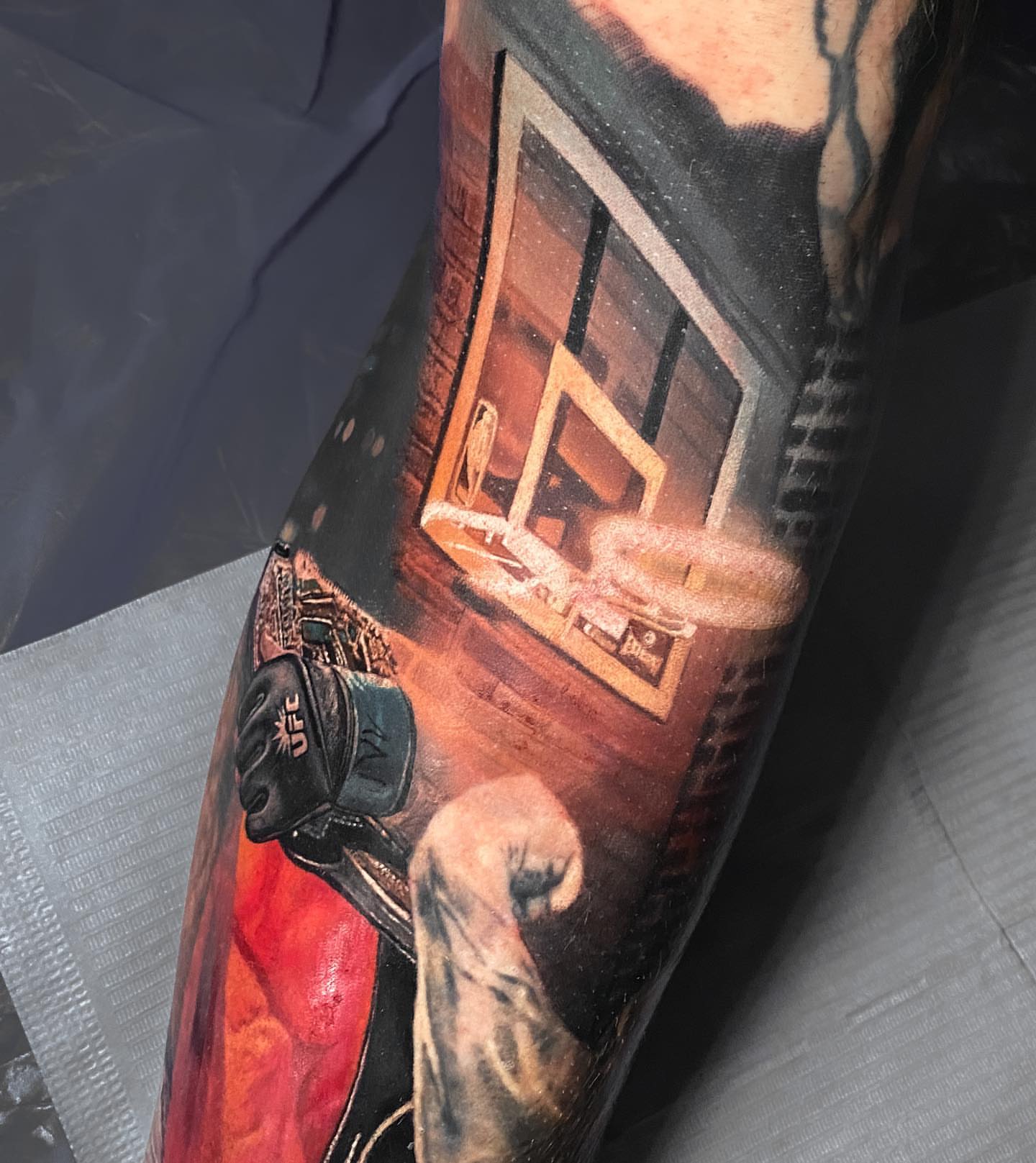 Basketball court realism tattoo on the forearm by Naboka Anastasiia