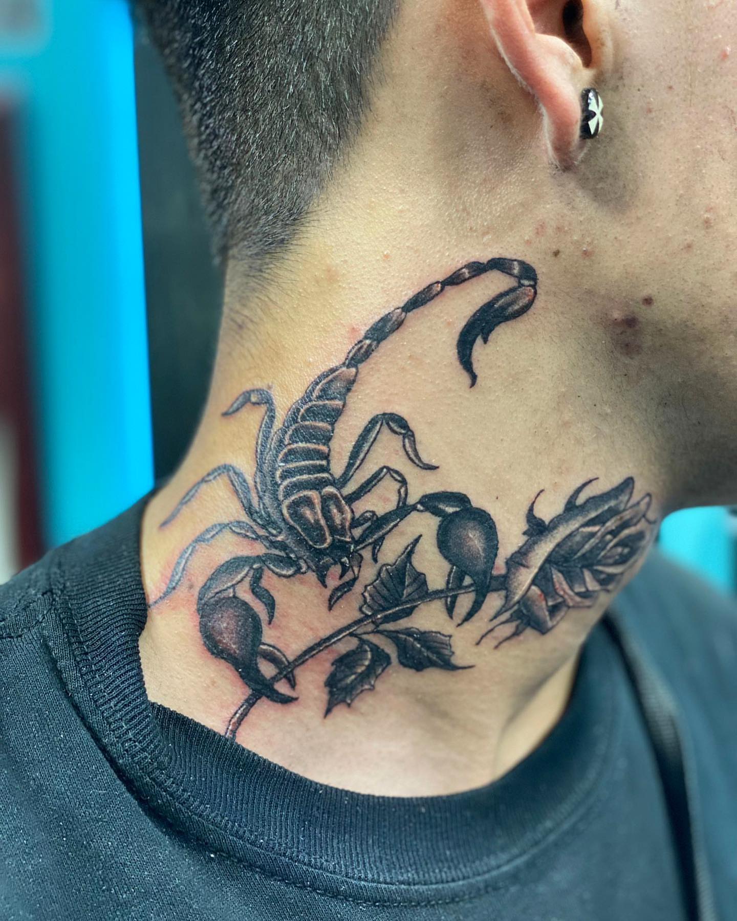 Scorpion and rose realism tattoo on the neck by Alberto Ramirez
