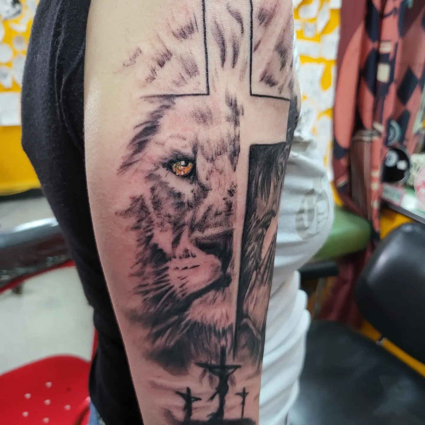 Lion realism tattoo on the forearm by Mike Stamper