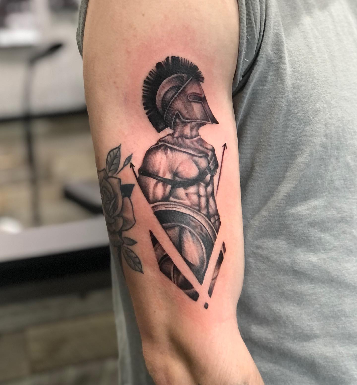 Spartan warrior black and grey tattoo on the forearm by Brian Keith