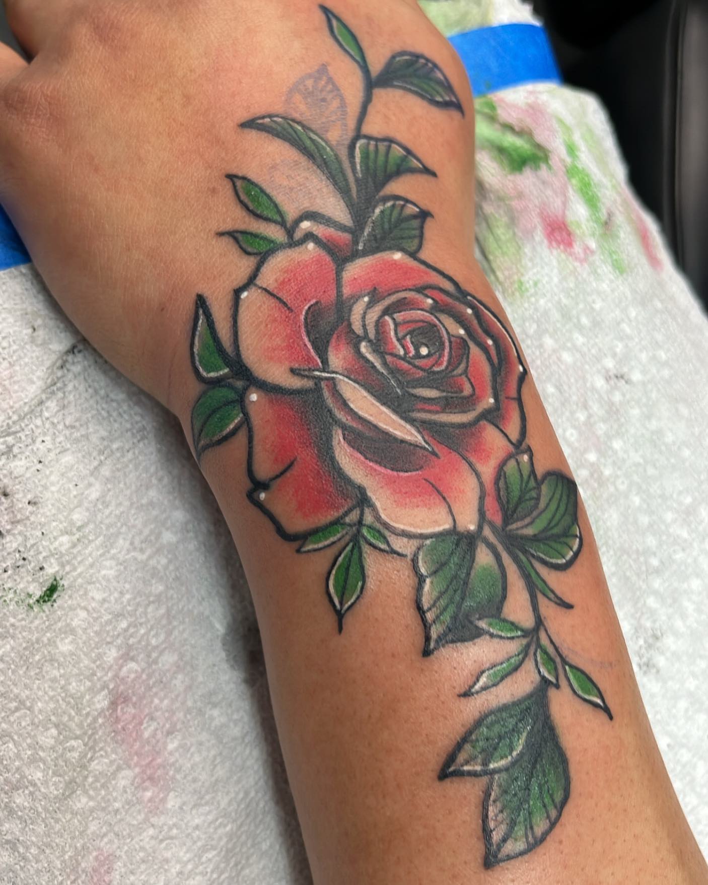 Red rose American traditional tattoo on the forearm by Edward A. Boesch