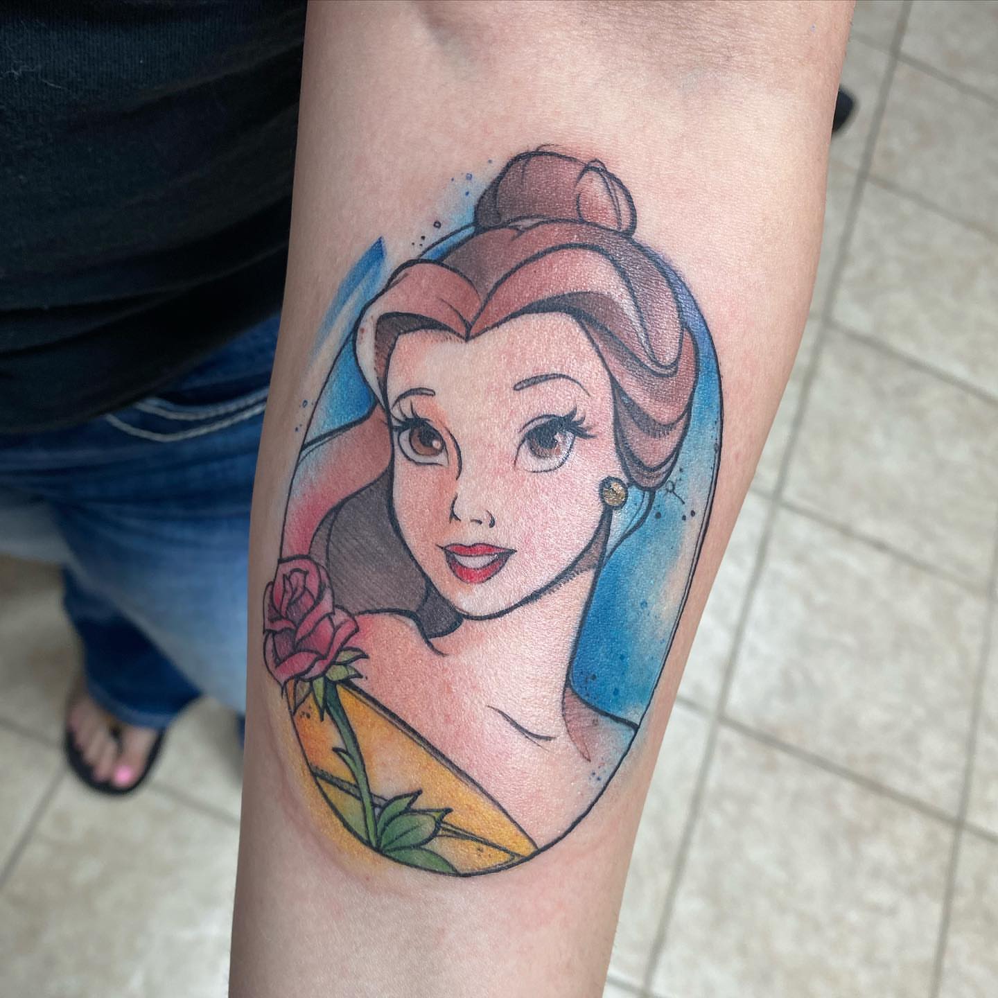 Belle watercolor tattoo on the forearm by Angel Rodriguez