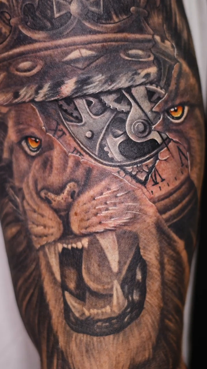 Lion with mechanical elements realism tattoo by Amaury Ramirez