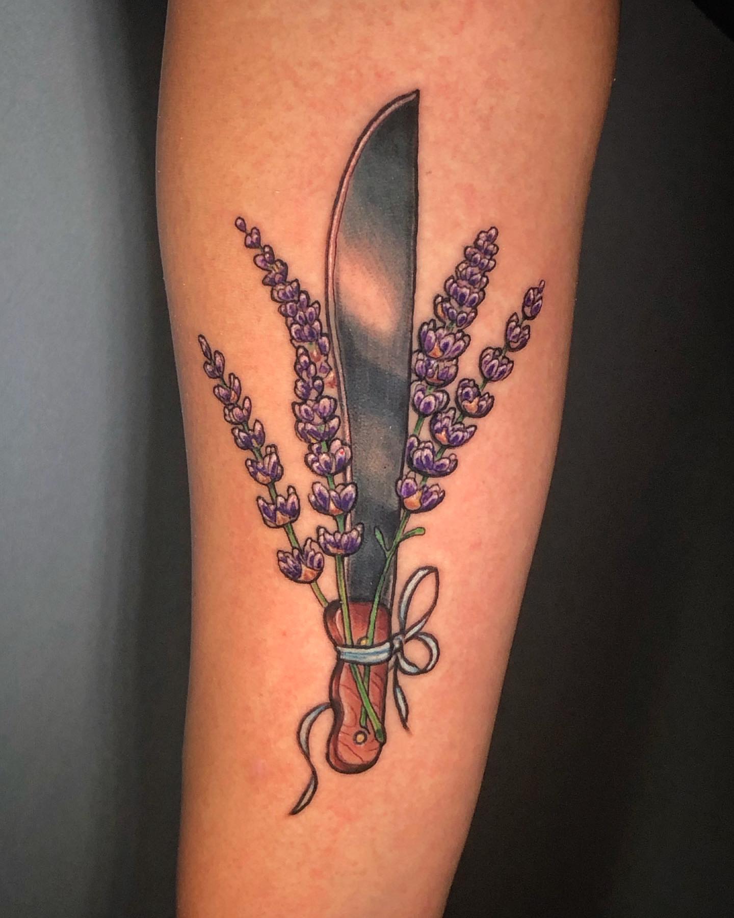 Lavender bouquet realism tattoo on the forearm by Josh Green