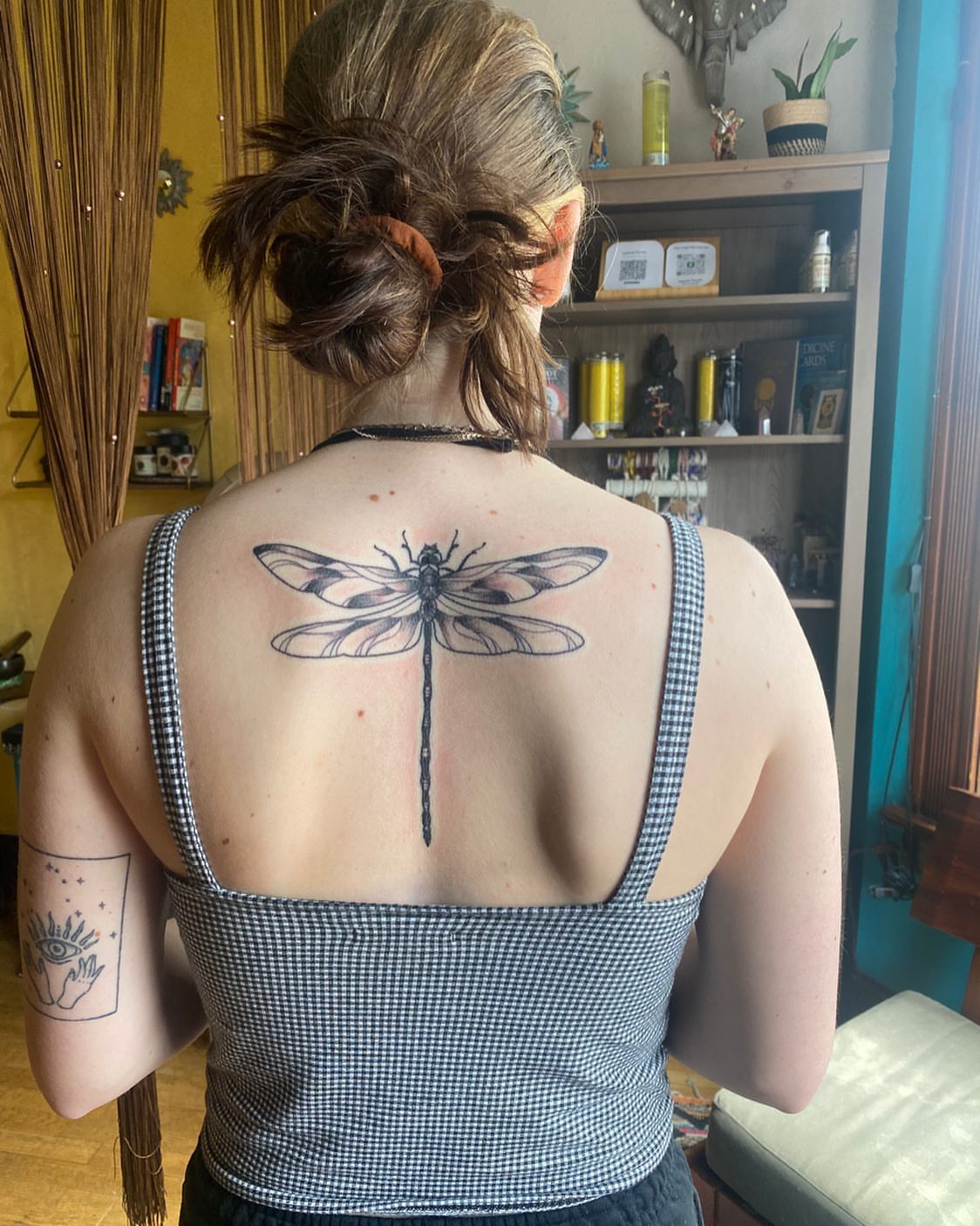 Dragonfly black and grey tattoo on the back by Shamanic Ink