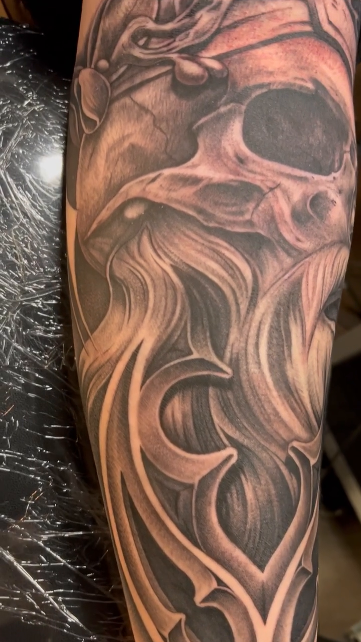 Skull with ornate filigree dark realism tattoo by Kyle Lopez, Union City, California