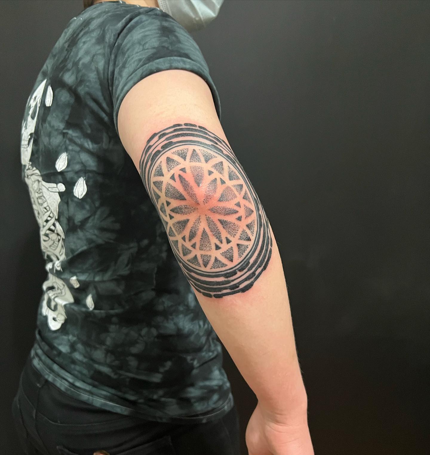 Geometric mandala dotwork tattoo on the forearm by Ałex, Portland, Oregon
