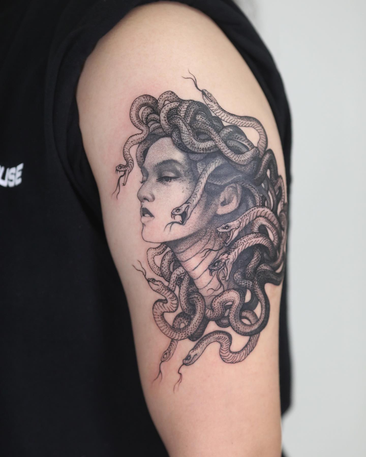 Medusa realism tattoo on the shoulder by Strokin Konstantin