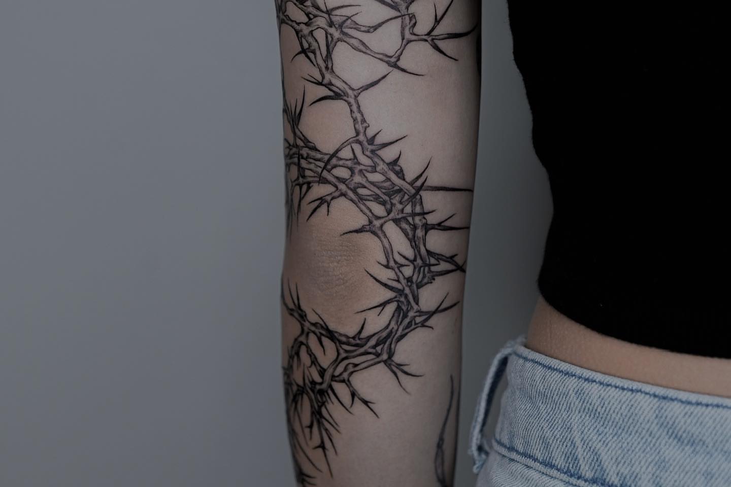 Thorn crown black and grey tattoo on the forearm by Zay - Realistic tattoo Artist