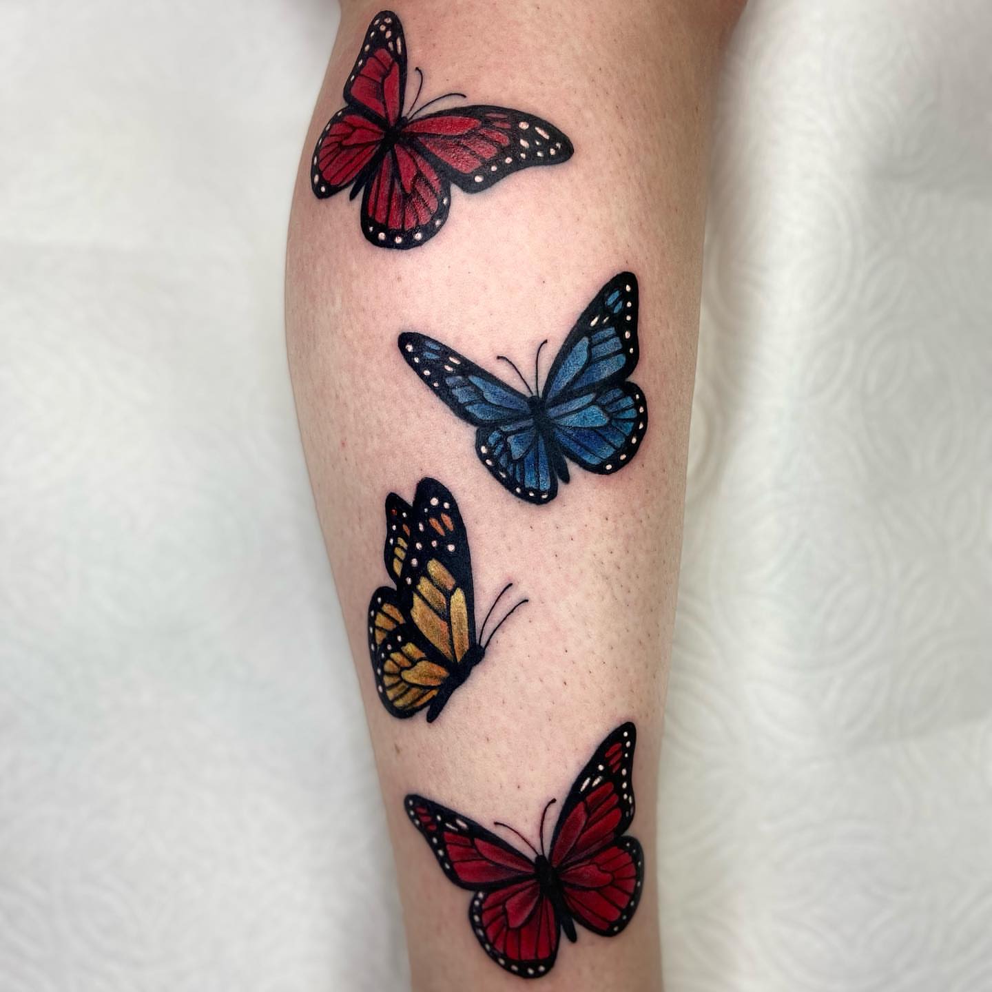 Butterflies realism tattoo on the forearm by Summer Rain