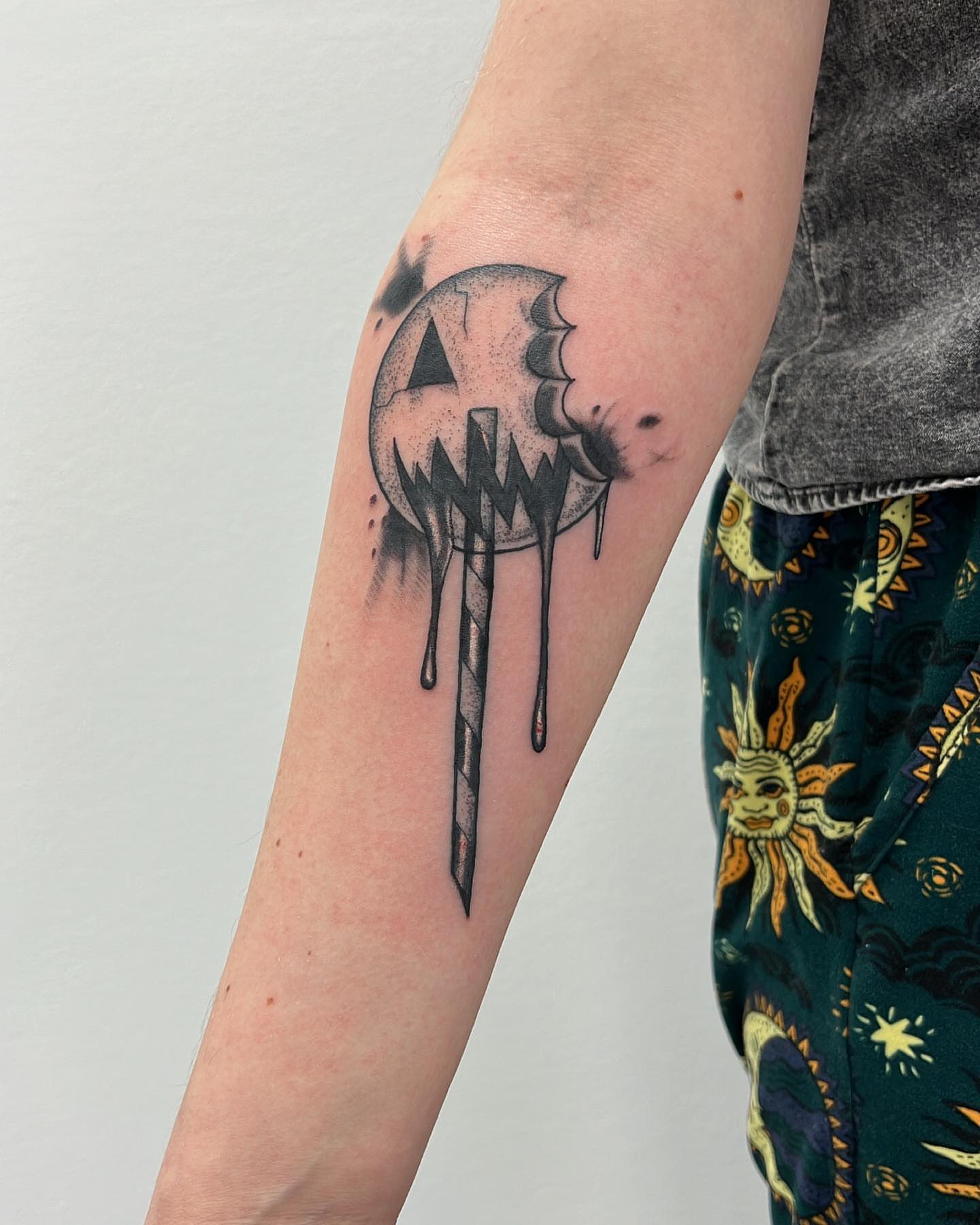 Jack-o'-lantern candle black and grey tattoo on the forearm by 𝕭𝖗𝖞𝖈𝖊 𝖂𝖎𝖑𝖑𝖎𝖆𝖒