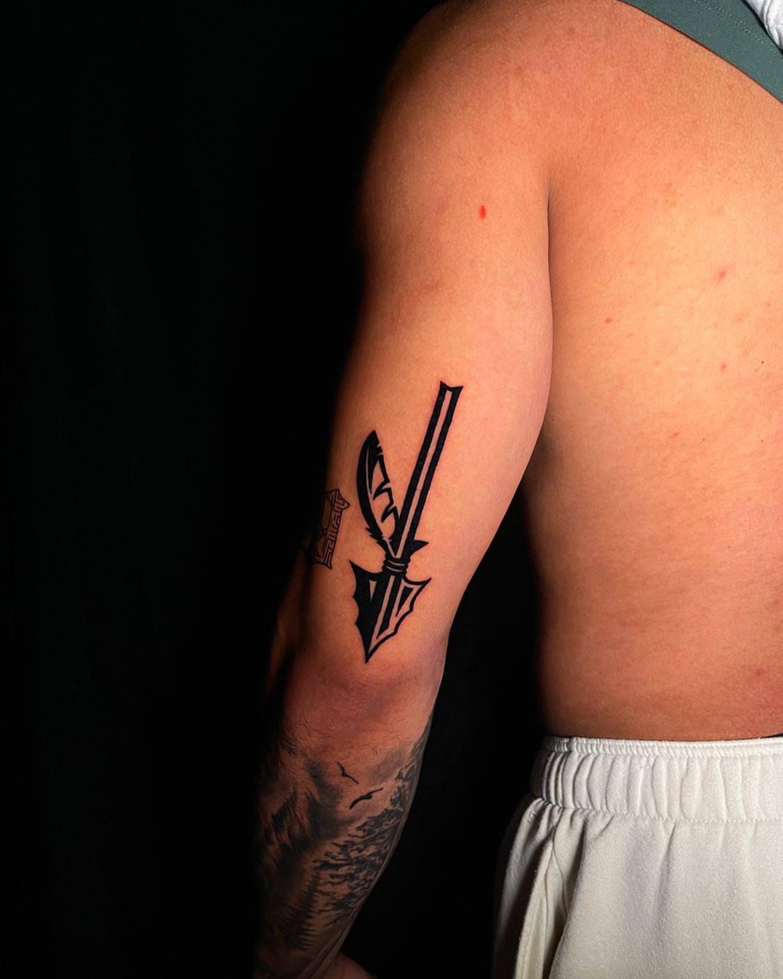 Swords black and grey tattoo on the forearm by Dori