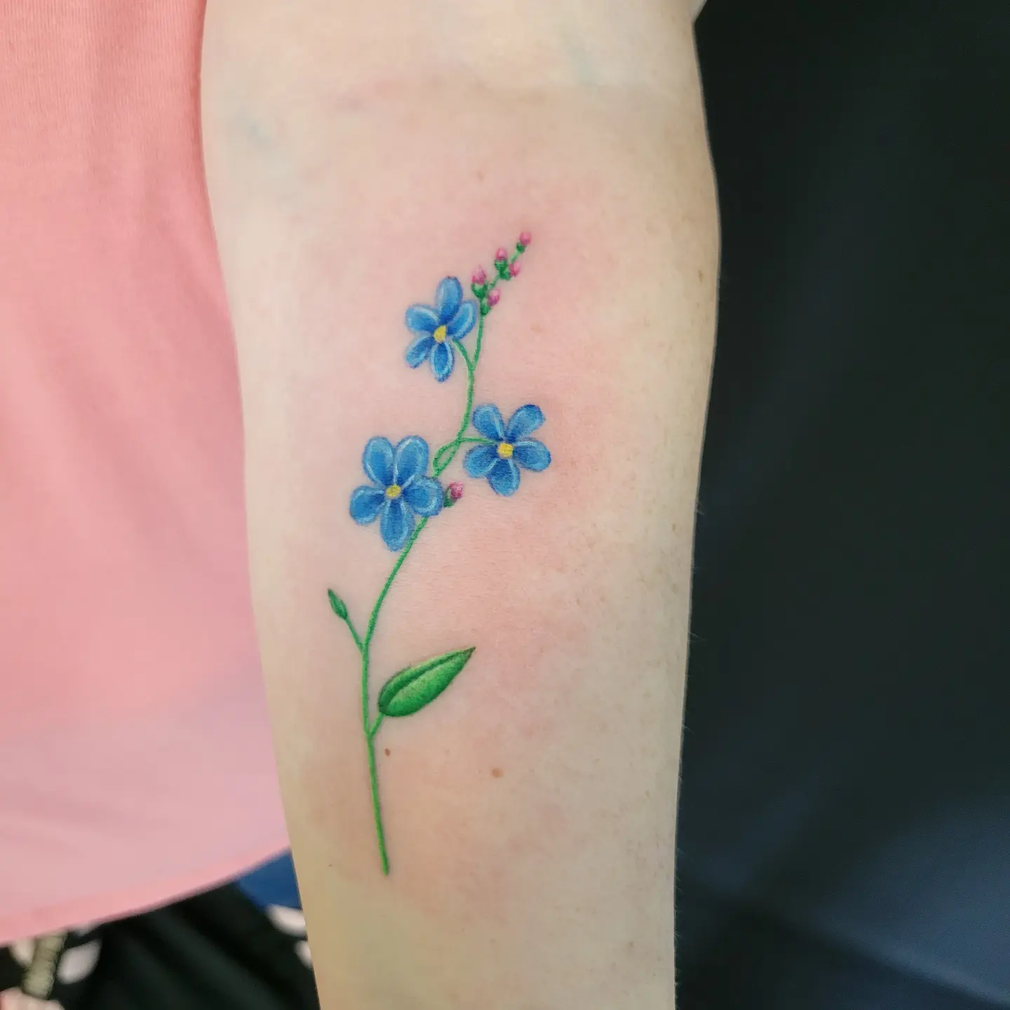 Forget-me-not flowers dotwork tattoo on the forearm by Nicole Bett