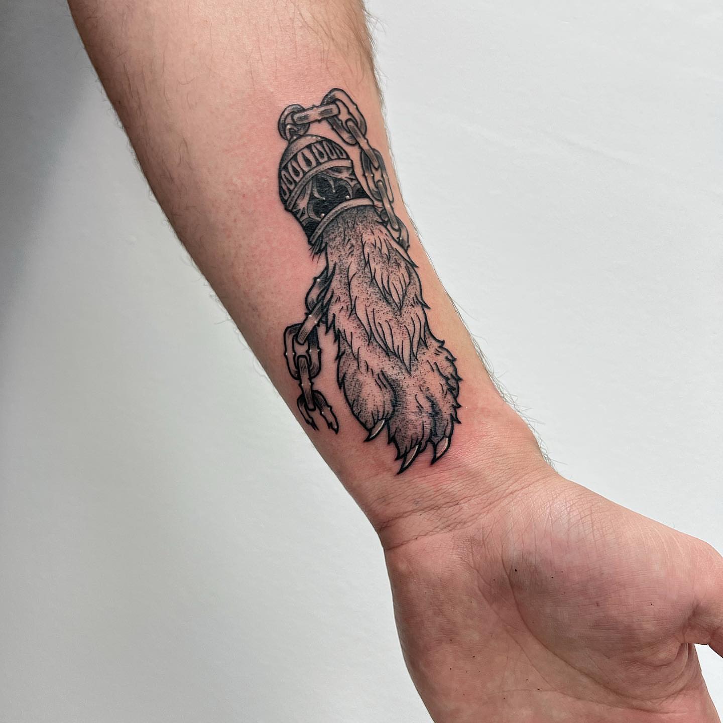 Bearded man with chains black and grey tattoo on the forearm by 𝕭𝖗𝖞𝖈𝖊 𝖂𝖎𝖑𝖑𝖎𝖆𝖒