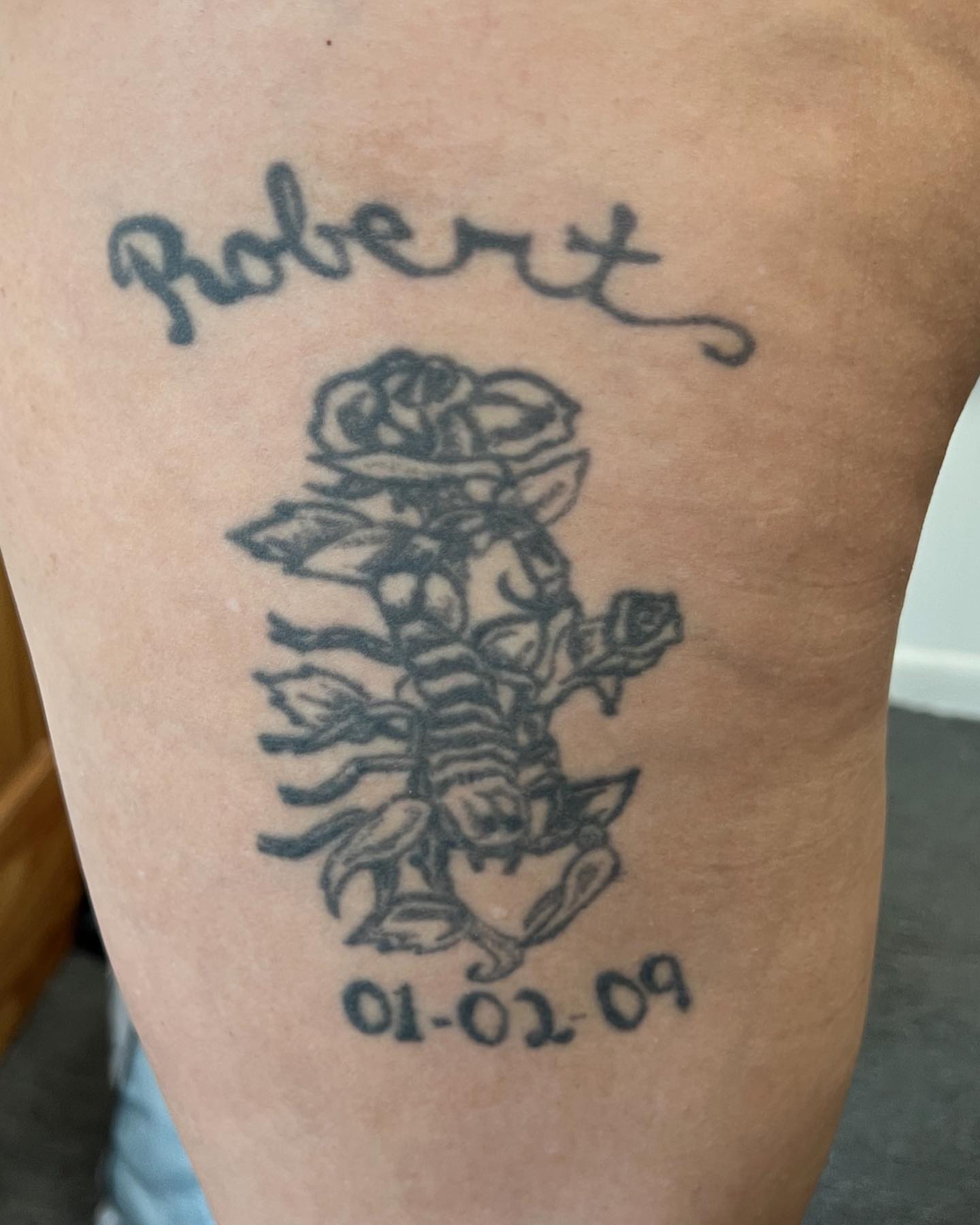 Scorpion and roses black and grey tattoo on the forearm by Dre Inks