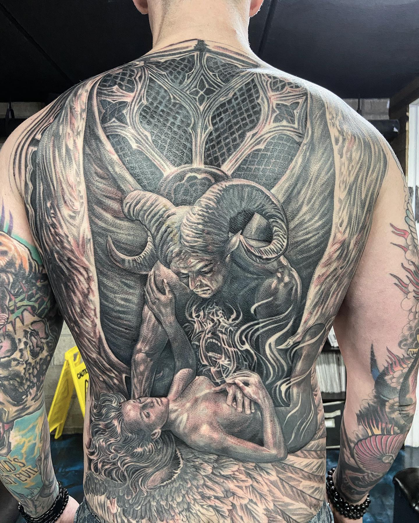Ram and woman realism tattoo on the back by Creeper tattoo