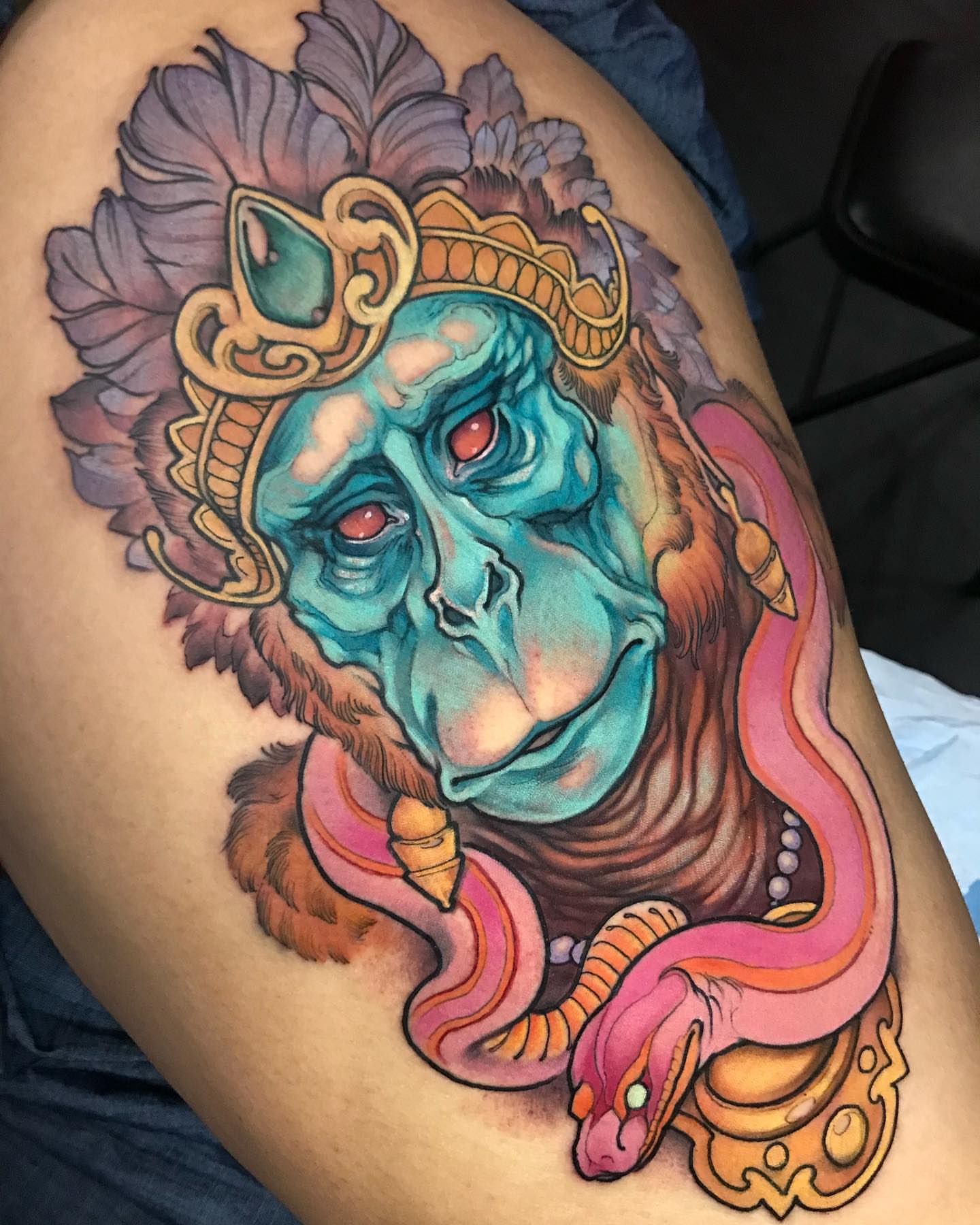 Monkey with snake new school tattoo on the thigh by Alisha Harding