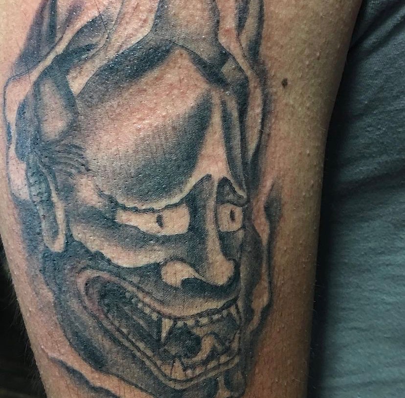 Skull black and grey tattoo on the forearm by Visionary Tattoos