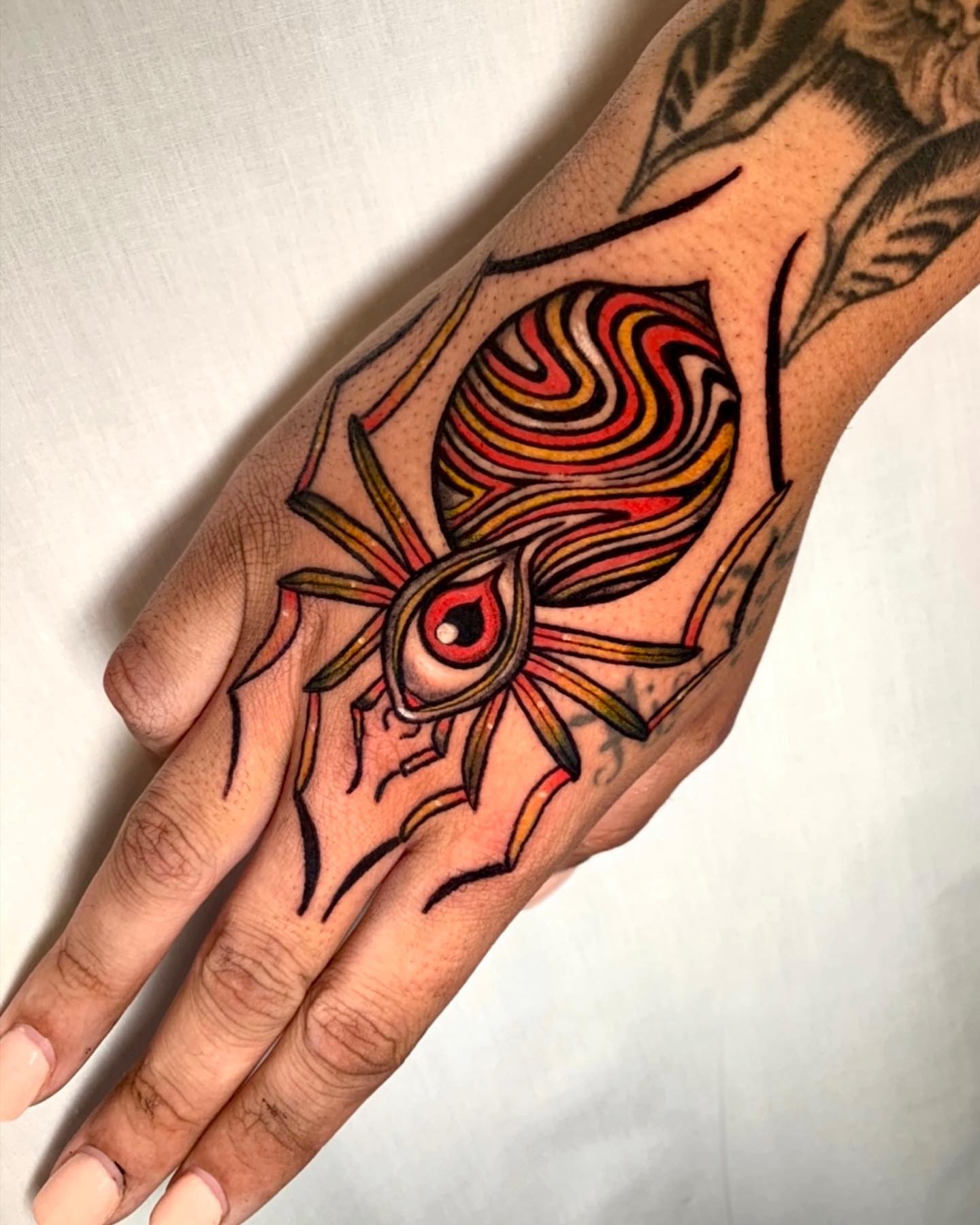Spider geometric tattoo on the hand by Cortney Norton