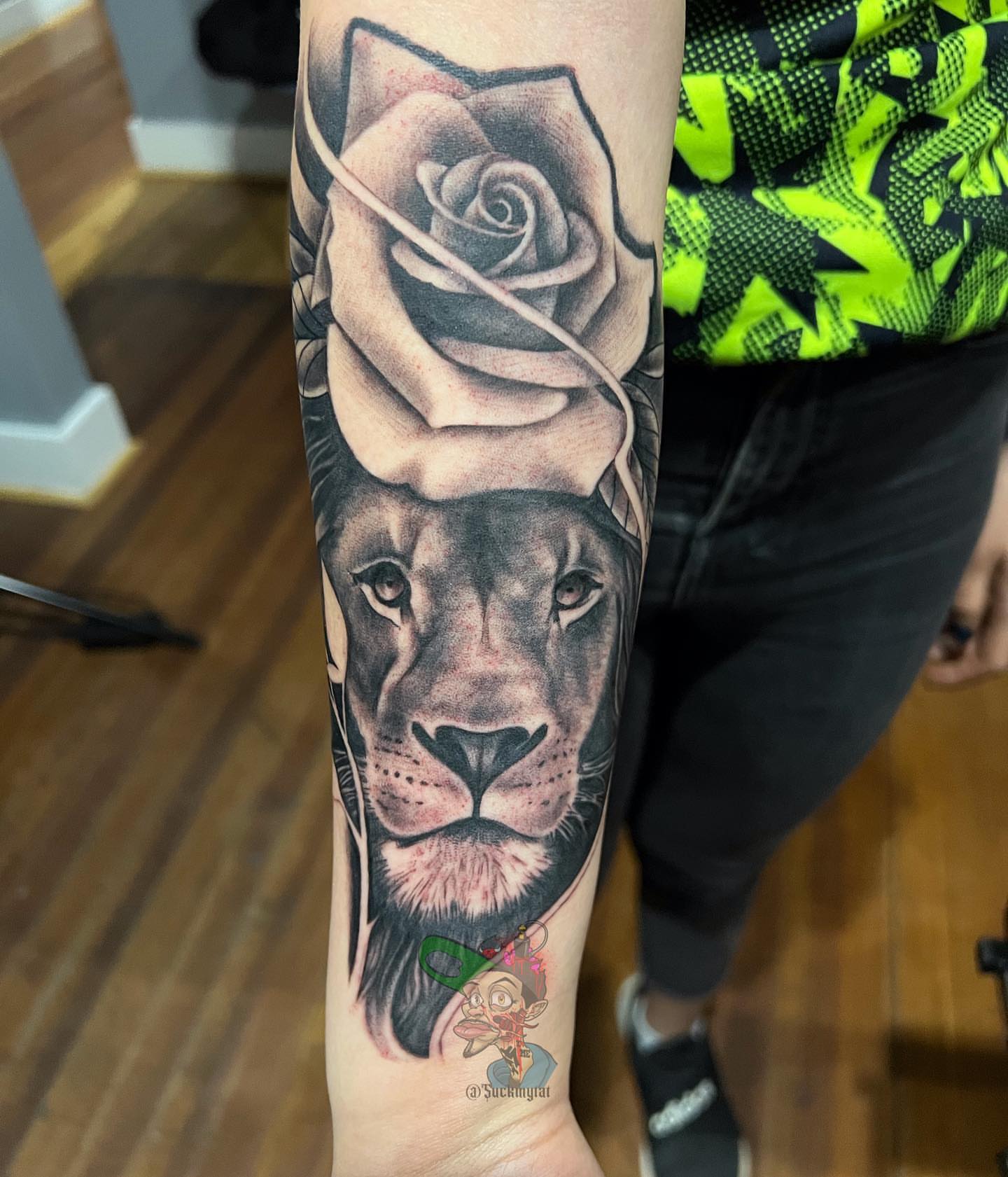 Lion and rose realism tattoo on the forearm by East Coast Rico