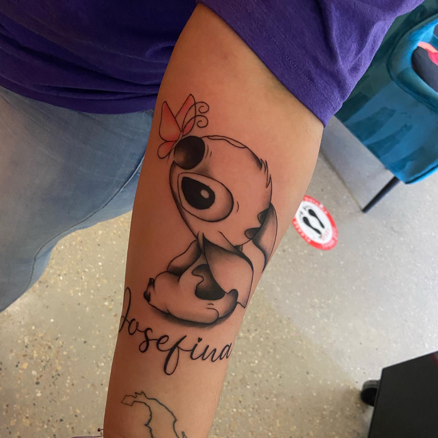 Baby Stitch black and grey tattoo on the forearm by Moose