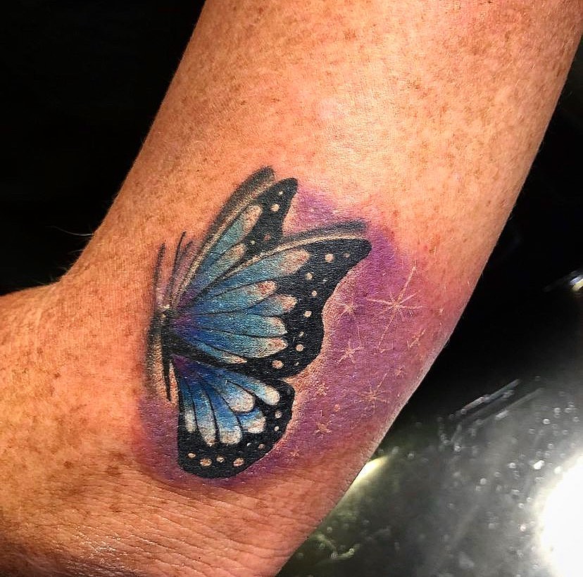 Butterfly dotwork tattoo on the forearm by Visionary Tattoos